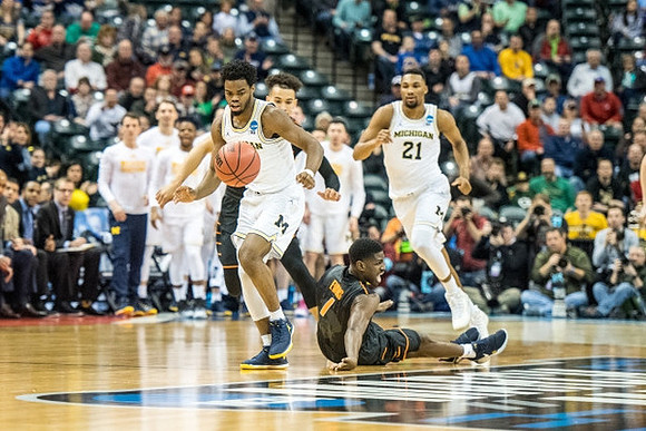 Derrick Walton Jr. (10) and Zak Irvin (21)