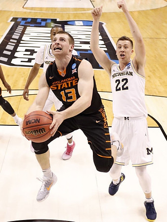 Muhammad-Ali Abdur-Rahkman (12) and Duncan Robinson (22)