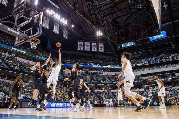 Moritz Wagner (13), D.J. Wilson (5), and Zak Irvin (21)