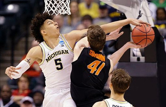 Derrick Walton Jr. (10) and Mark Donnal (34)