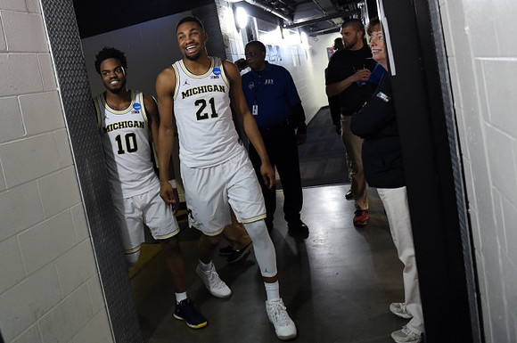 Derrick Walton Jr. (10) and Zak Irvin (21)