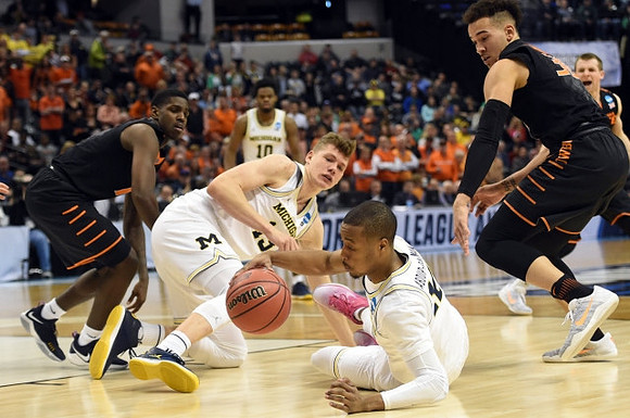 Derrick Walton Jr. (10), Moritz Wagner (13), and Muhammad-Ali Abdur-Rahkman (12)