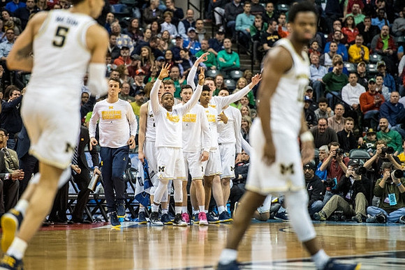 D.J. Wilson (5) and Derrick Walton Jr. (10)