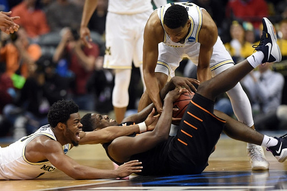 Derrick Walton Jr. (10) and Zak Irvin (21)