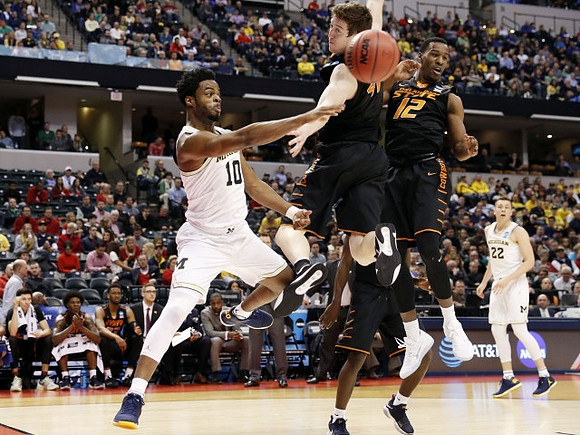 Derrick Walton Jr. (10) and Duncan Robinson (22)