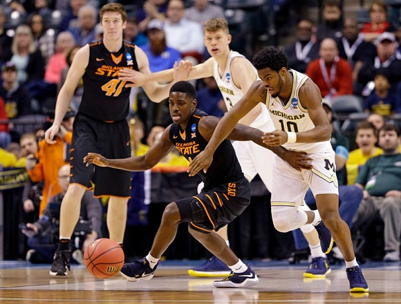 Moritz Wagner (13) and Derrick Walton Jr. (10)