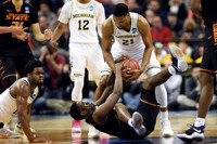 Derrick Walton Jr. (10), Muhammad-Ali Abdur-Rahkman (12), and Zak Irvin (21)