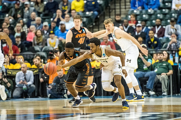 Derrick Walton Jr. (10) and Moritz Wagner (13)