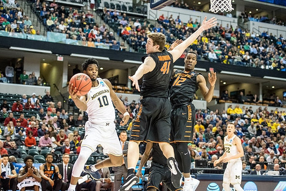 Derrick Walton Jr. (10) and Duncan Robinson (22)