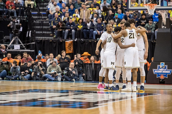 Muhammad-Ali Abdur-Rahkman (12), Derrick Walton Jr. (10), Duncan Robinson (22), Zak Irvin (21), and D.J. Wilson (5)
