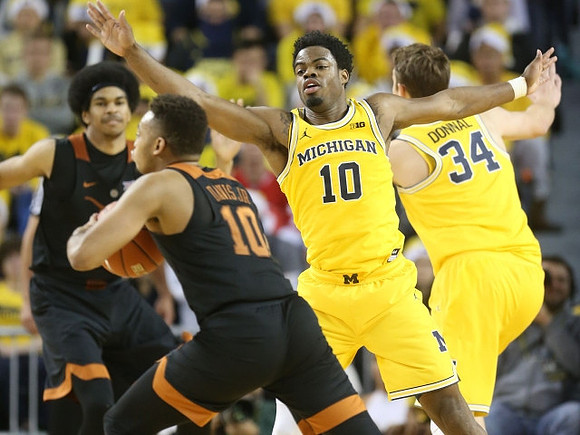 Derrick Walton Jr. (10) and Mark Donnal (34)