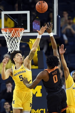 D.J. Wilson (5) and Muhammad-Ali Abdur-Rahkman (12)