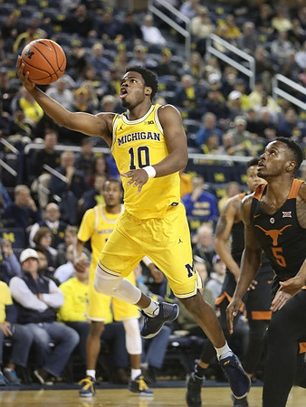 Derrick Walton Jr. (10) and Muhammad-Ali Abdur-Rahkman (12)