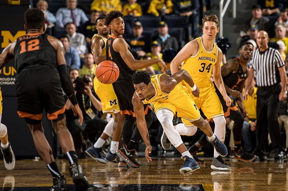Derrick Walton Jr. (10) and Mark Donnal (34)