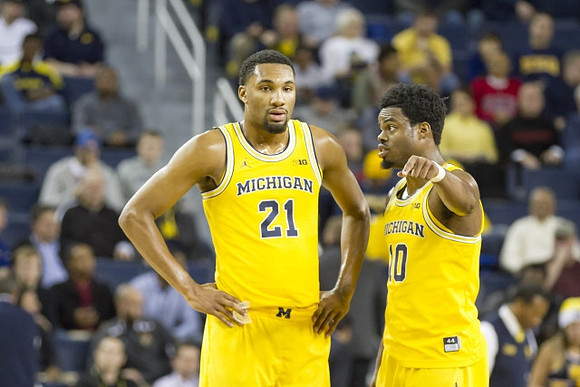 Zak Irvin (21) and Derrick Walton Jr. (10)