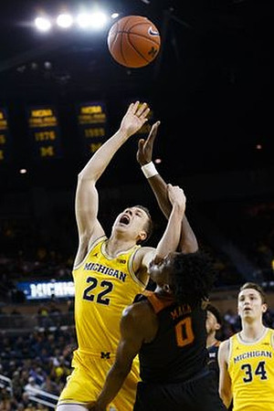 Duncan Robinson (22) and Mark Donnal (34)