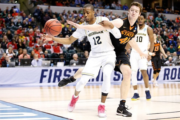 Muhammad-Ali Abdur-Rahkman (12) and Derrick Walton Jr. (10)