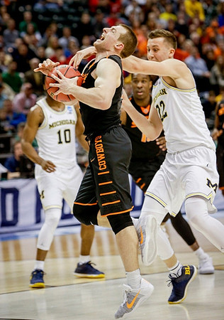 Derrick Walton Jr. (10) and Duncan Robinson (22)