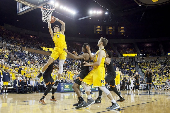 D.J. Wilson (5), Mark Donnal (34), and Duncan Robinson (22)