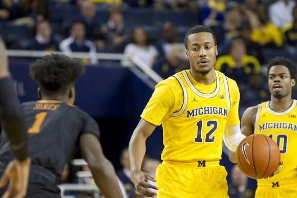 Muhammad-Ali Abdur-Rahkman (12) and Derrick Walton Jr. (10)