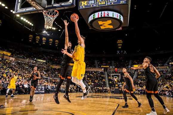 Derrick Walton Jr. (10) and Moritz Wagner (13)