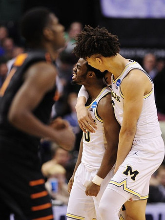 Derrick Walton Jr. (10) and D.J. Wilson (5)