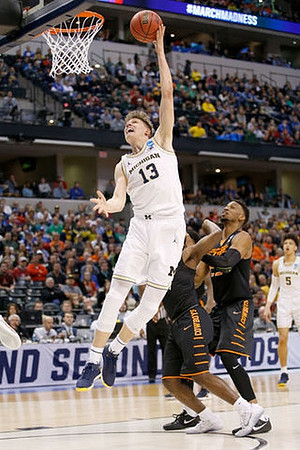 Moritz Wagner (13) and D.J. Wilson (5)