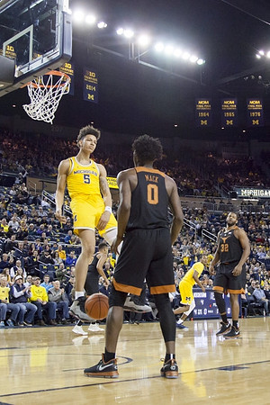 D.J. Wilson (5) and Muhammad-Ali Abdur-Rahkman (12)