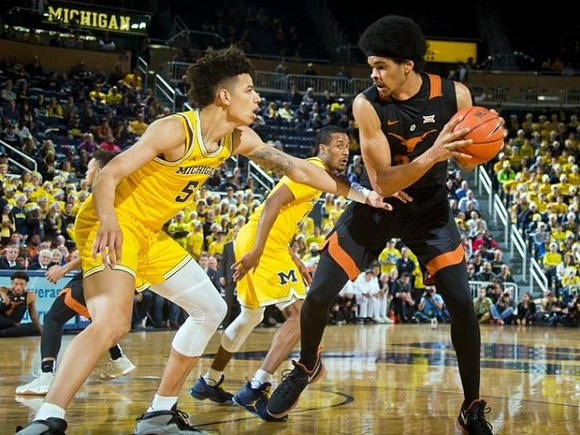 D.J. Wilson (5) and Muhammad-Ali Abdur-Rahkman (12)