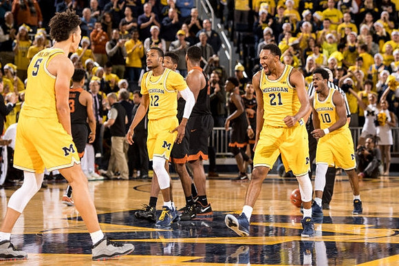D.J. Wilson (5), Muhammad-Ali Abdur-Rahkman (12), Zak Irvin (21), and Derrick Walton Jr. (10)