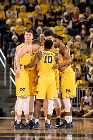 Moritz Wagner (13), Duncan Robinson (22), Derrick Walton Jr. (10), Zak Irvin (21), and D.J. Wilson (5)