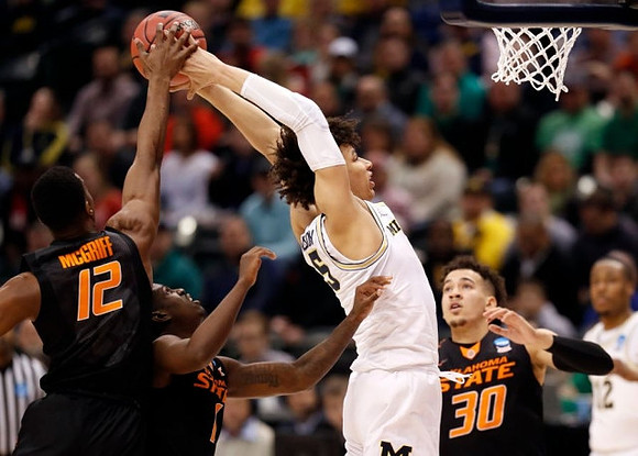 D.J. Wilson (5) and Muhammad-Ali Abdur-Rahkman (12)