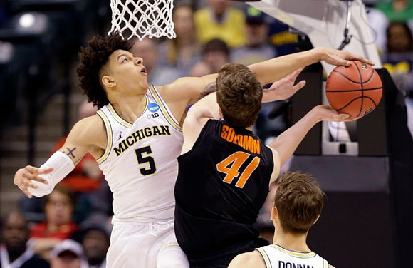 D.J. Wilson (5) and Mark Donnal (34)