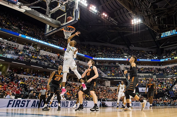 Muhammad-Ali Abdur-Rahkman (12) and Derrick Walton Jr. (10)