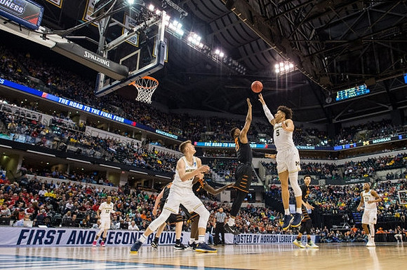 Muhammad-Ali Abdur-Rahkman (12), Moritz Wagner (13), D.J. Wilson (5), and Zak Irvin (21)