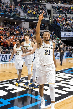 Derrick Walton Jr. (10), D.J. Wilson (5), Duncan Robinson (22), and Zak Irvin (21)
