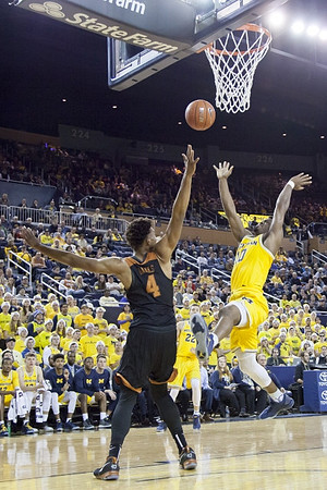 Derrick Walton Jr. (10) and Duncan Robinson (22)