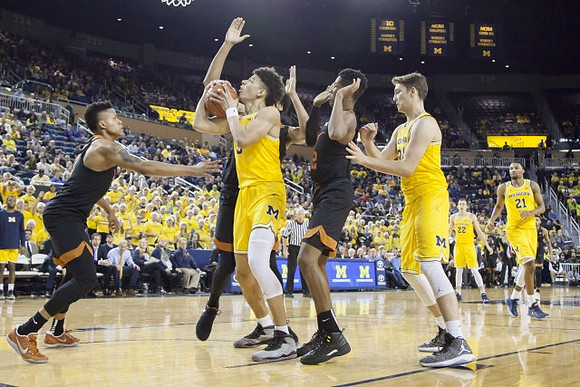 D.J. Wilson (5), Mark Donnal (34), Duncan Robinson (22), and Zak Irvin (21)