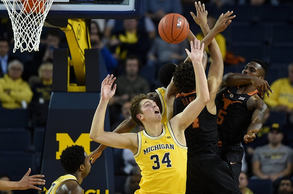 Derrick Walton Jr. (10) and Mark Donnal (34)