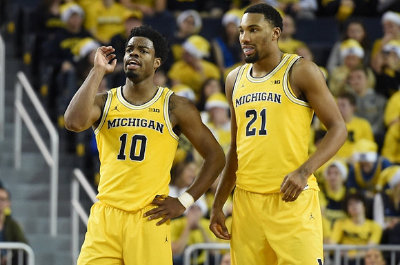 Derrick Walton Jr. (10) and Zak Irvin (21)