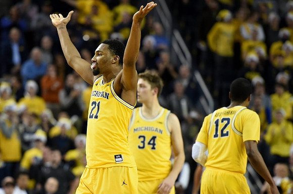 Zak Irvin (21), Mark Donnal (34), and Muhammad-Ali Abdur-Rahkman (12)
