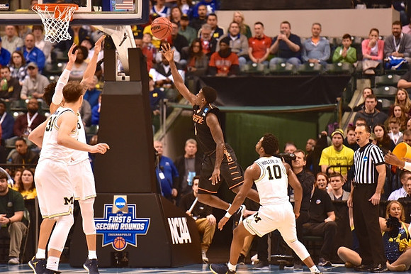 D.J. Wilson (5), Mark Donnal (34), and Derrick Walton Jr. (10)