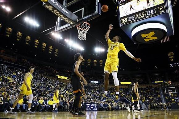 Muhammad-Ali Abdur-Rahkman (12) and D.J. Wilson (5)