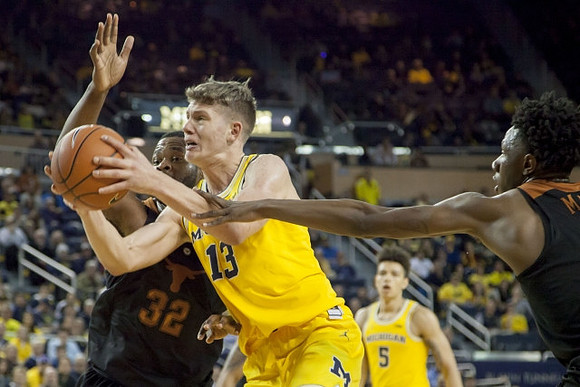 Moritz Wagner (13) and D.J. Wilson (5)