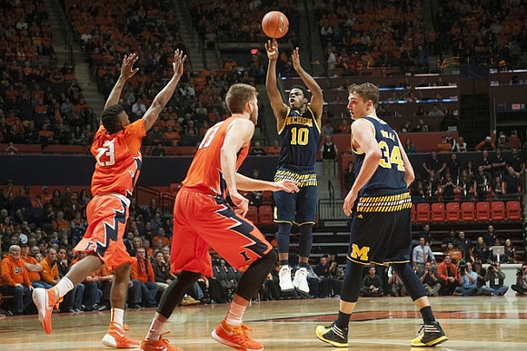 Derrick Walton Jr. (10) and Mark Donnal (34)