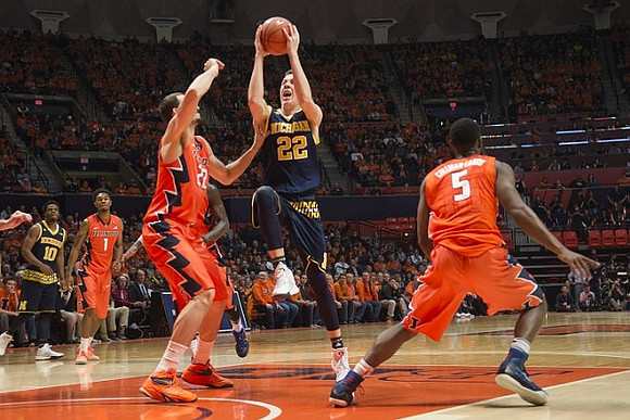 Derrick Walton Jr. (10) and Duncan Robinson (22)