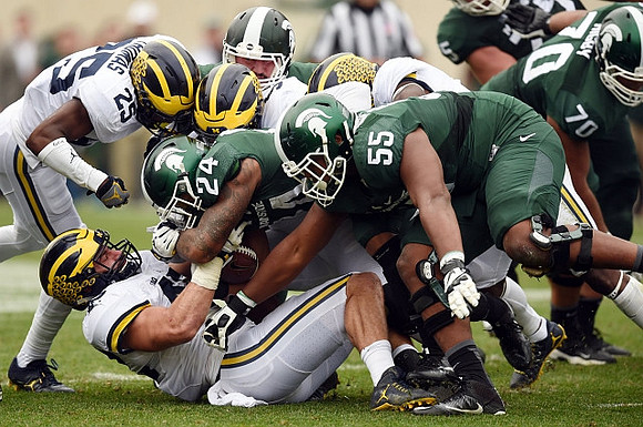Dymonte Thomas (25) and Ben Gedeon (42)