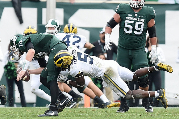 Jabrill Peppers (5) and Ben Gedeon (42)