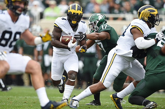 Jake Butt (88) and De'Veon Smith (4)