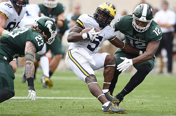 Jake Butt (88) and Jabrill Peppers (5)